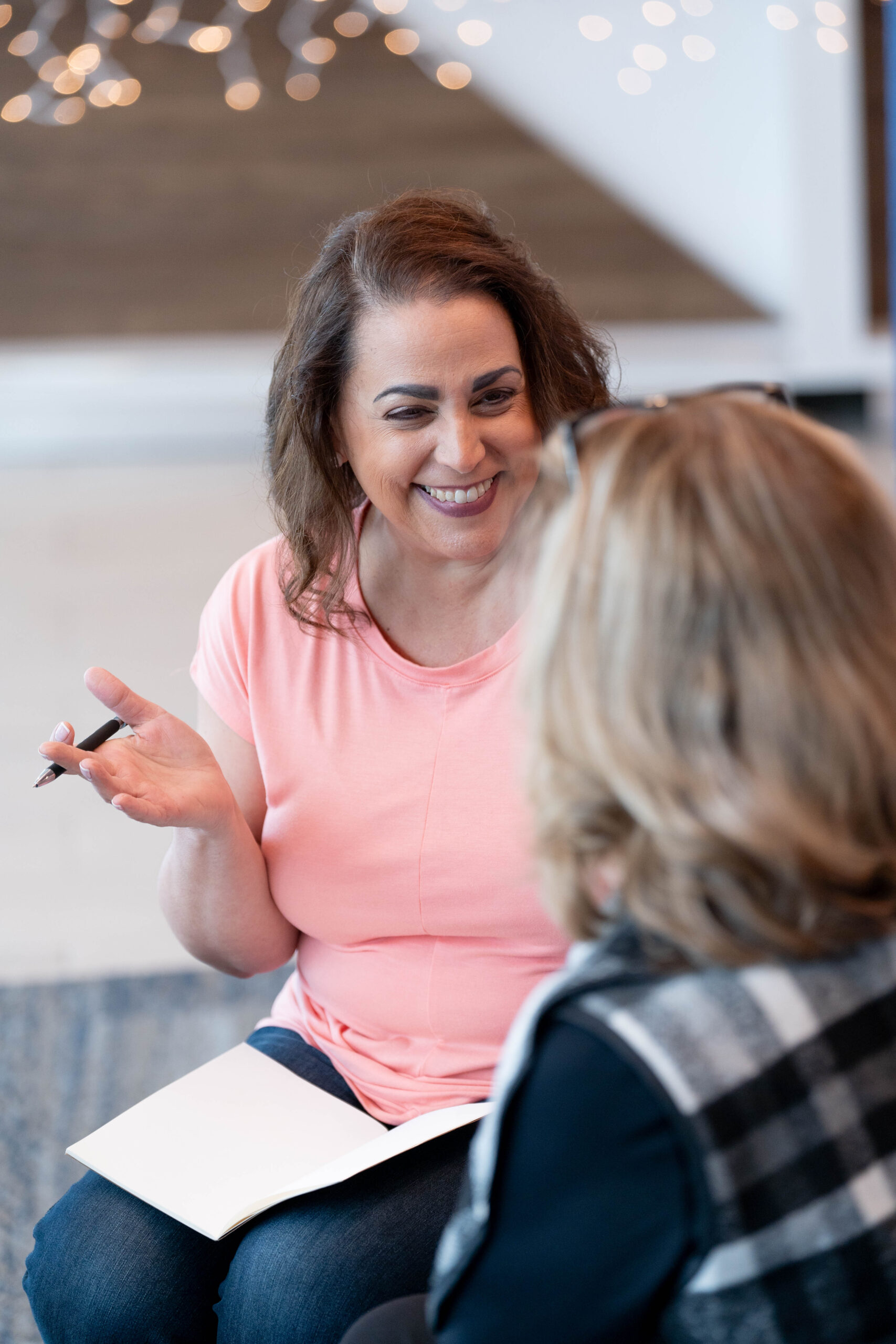 woman taking notes in a meeting